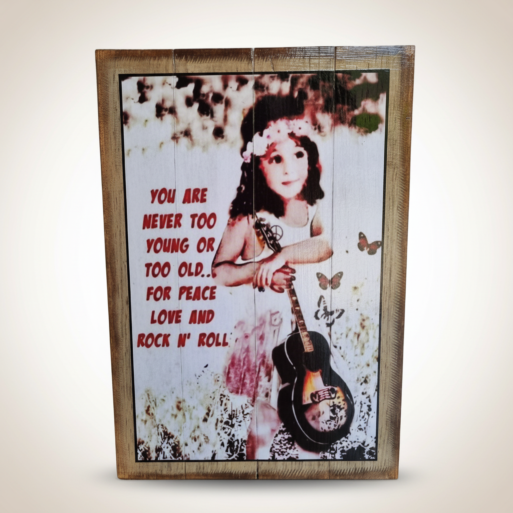 Wooden inspirational quote sign with a child and guitar, reading “Never too young or too old for peace, love and rock ’n’ roll”