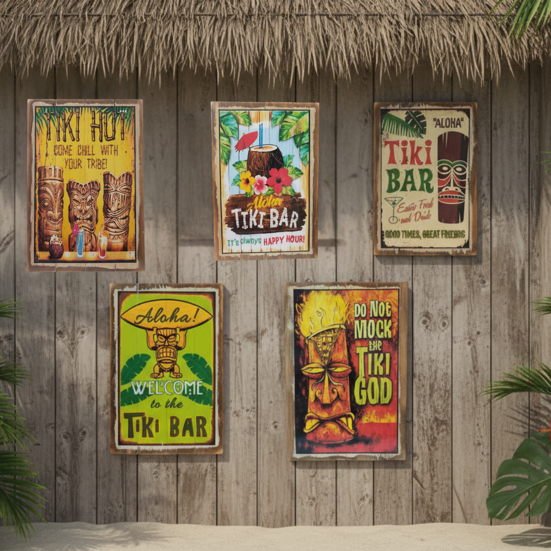 Five framed tropical tiki-themed wall art prints are displayed on a rustic wooden wall under a thatched roof, with palm leaves at the sides.