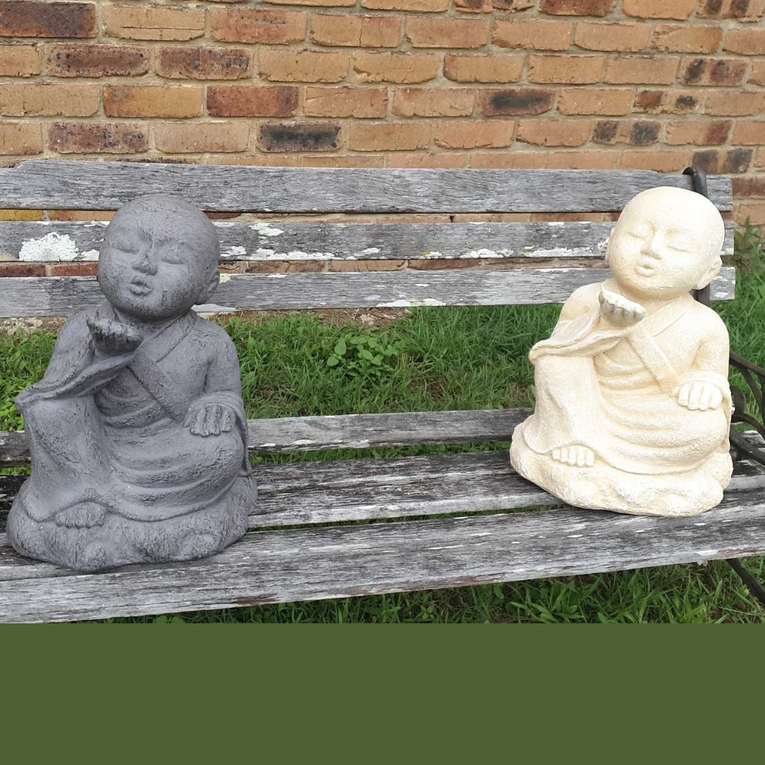 2 designs set on a bench Cream seated figure with closed eyes 