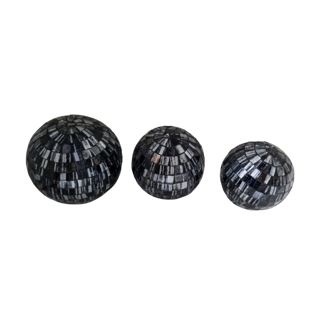 Three mosaic decorative balls in gray, each with a geometric pattern made of small tiles.