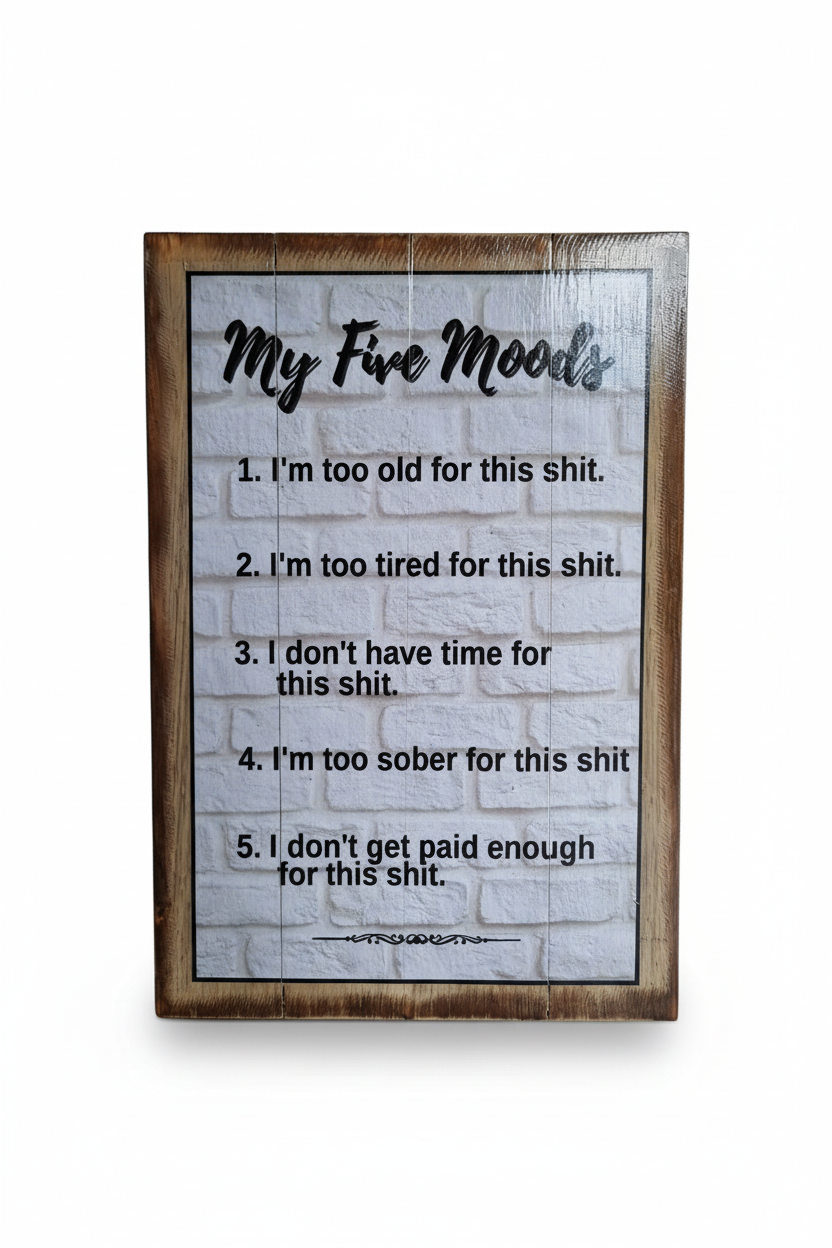 A rectangular wooden sign with a rustic brown frame and a white faux-brick background, featuring the text 'My Fire Moods' and five humorous lines printed in black. The sign is photographed against a clean white background.