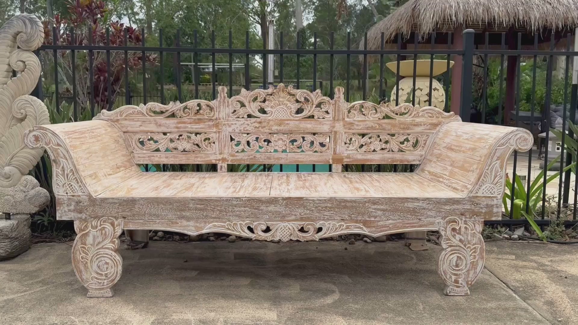 Balinese hand-carved whitewashed reclaimed teak day bed – video showing full piece beside pool with Balinese thatched gazebo, tropical garden and pool in background – handcrafted outdoor furniture by Azure Decor