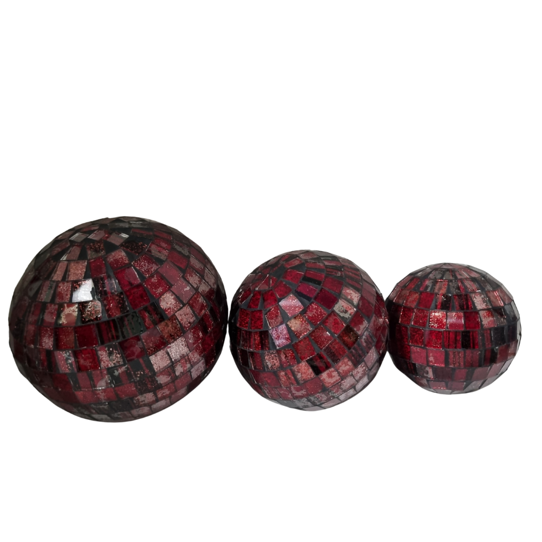 Three mosaic decorative balls in red, each with a geometric pattern made of small tiles.