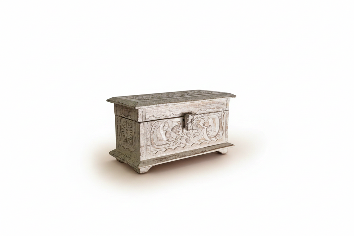 A small carved wooden chest with a weathered, light gray finish and ornate floral detailing on the front, shown on a plain white background.