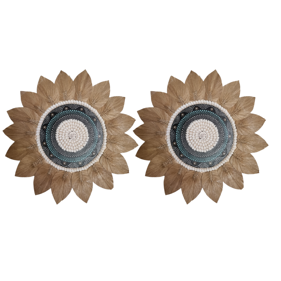 Two sunflower-shaped decorative items with a central circular design on a white background