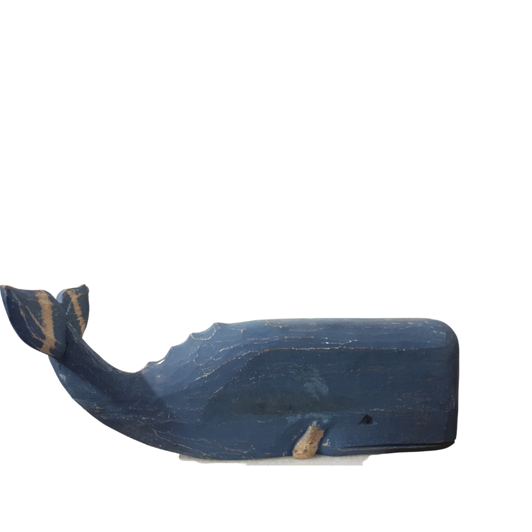 A wooden carved whale decoration in dark blue color with a rustic finish.