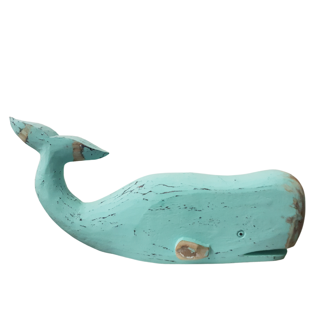 turquoise whale statue on white background