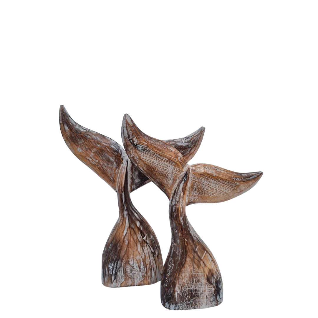 wooden whale tails finished in a brown wash finish on a white back ground 