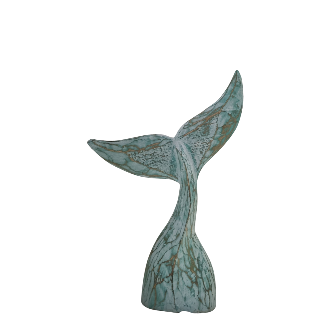 turquotise colour wash whale tail on white back gound 