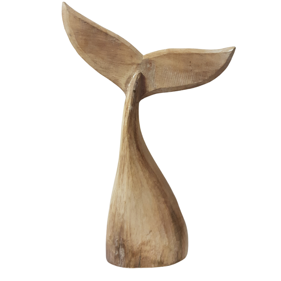 A handcrafted wooden carving of a whale tail with natural wood color and subtle blue hints.