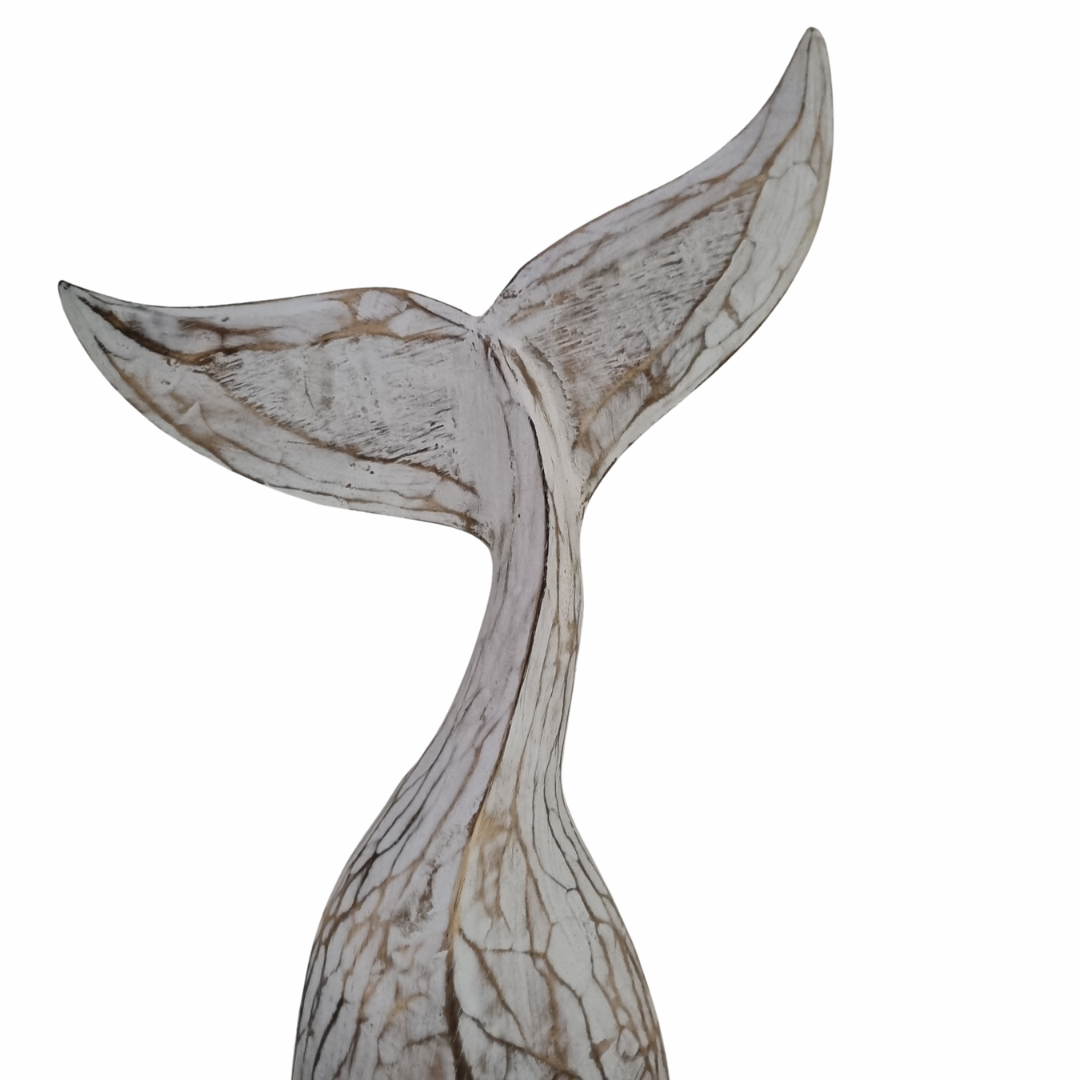 Decorative whale tail sculpture on a white background