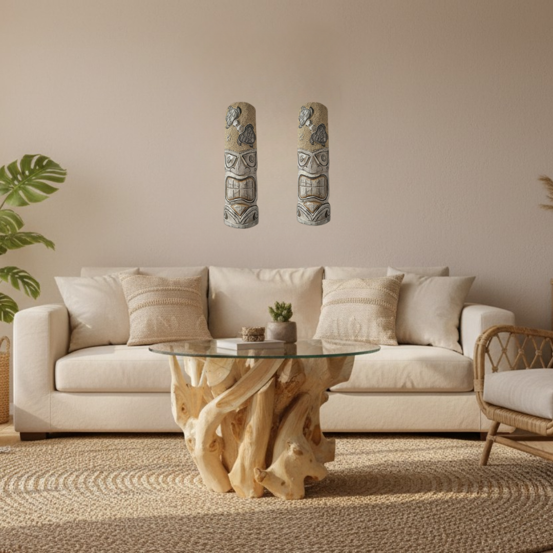 Teak root glass-top coffee table with organic natural timber base on a round jute rug in a coastal boho living room