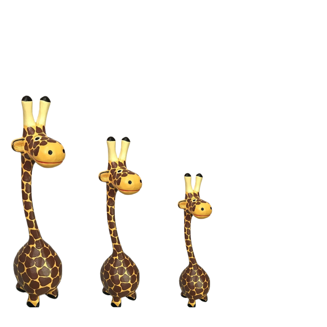 Three giraffe figurines of different sizes on a white background
