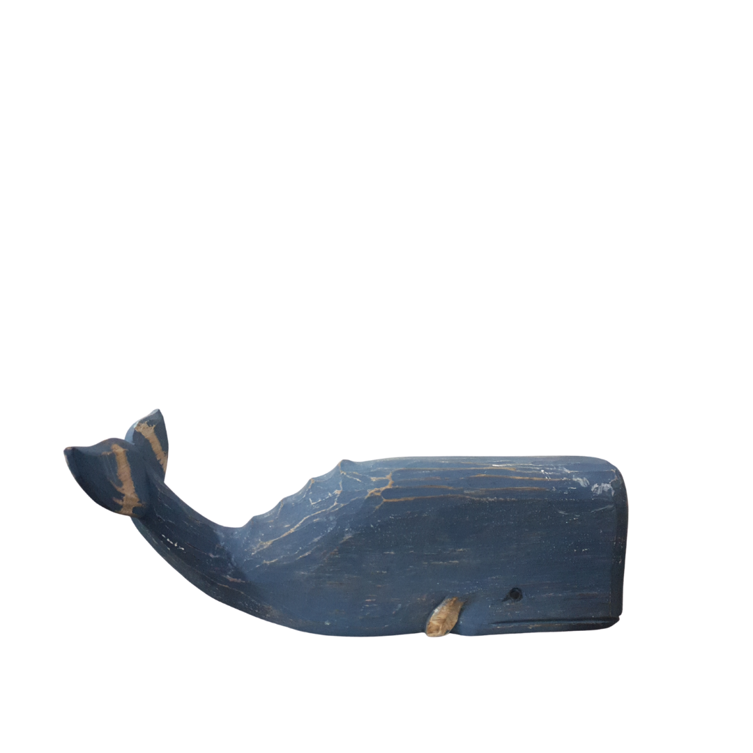 A wooden carved whale decoration in blue color with a rustic finish.