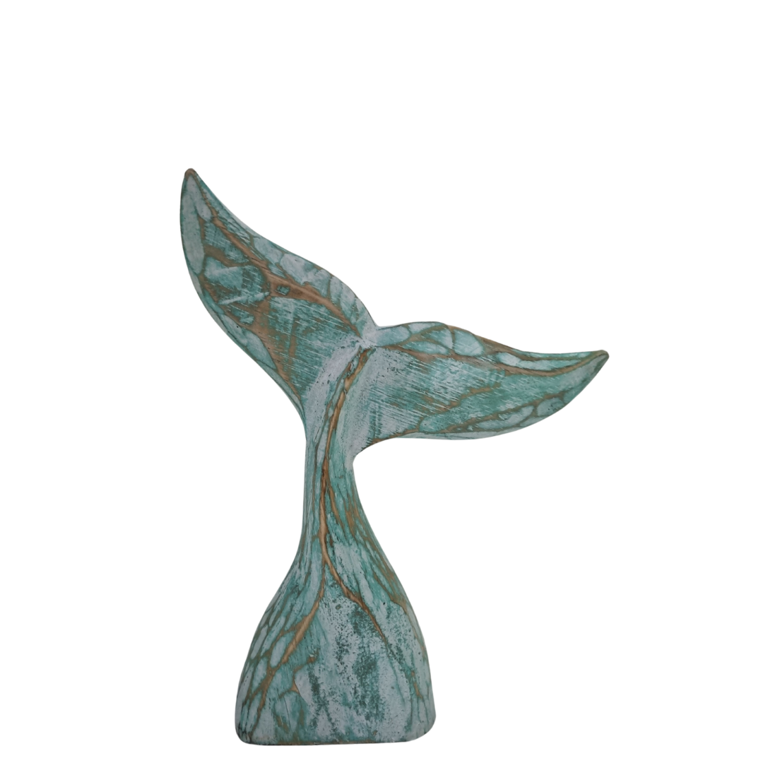 small turquoise whale tail on a white back 