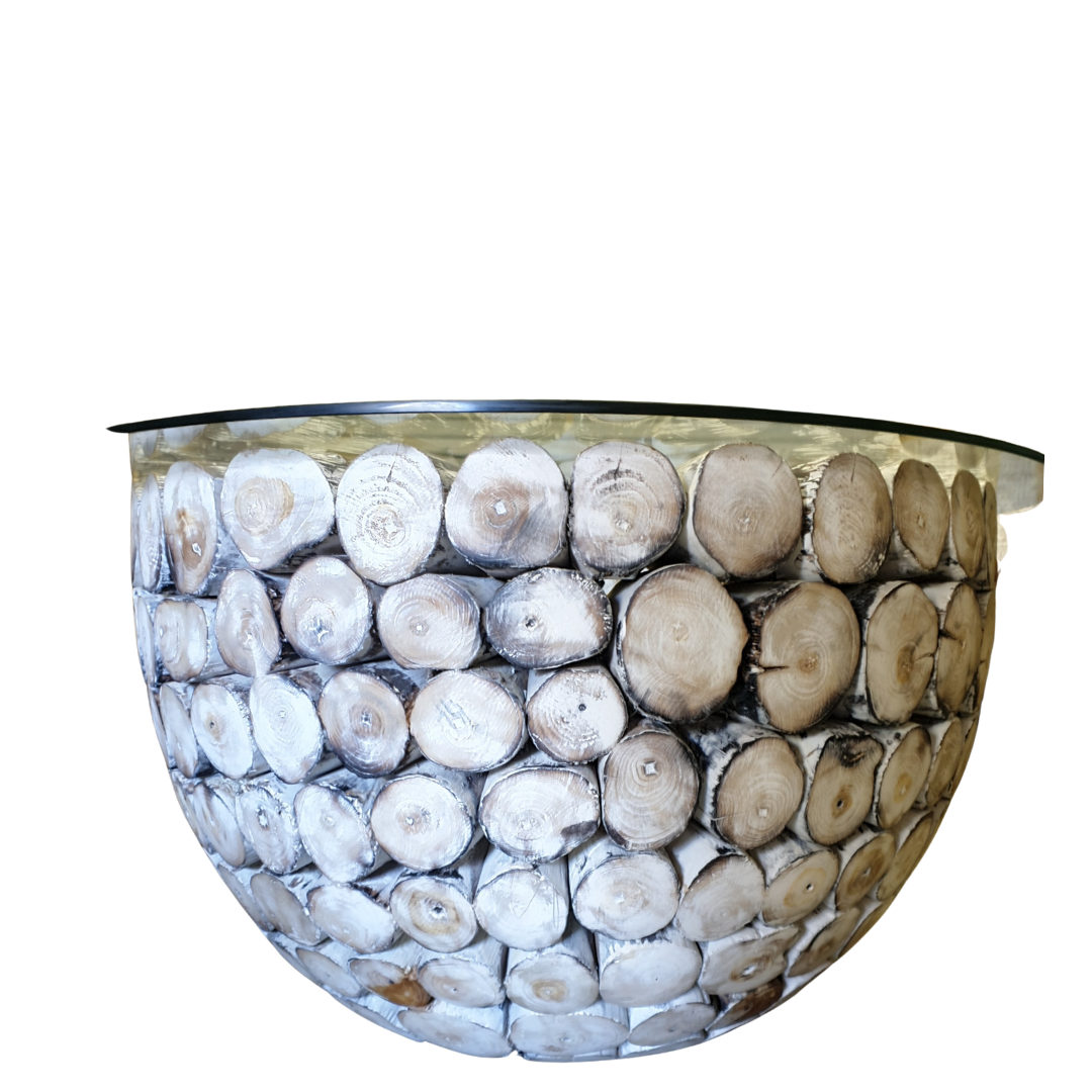 Round whitewashed driftwood log coffee table with clear glass top – side view showing full dome base of stacked teak logs, whitewashed coastal finish, handcrafted furniture by Azure Decor
