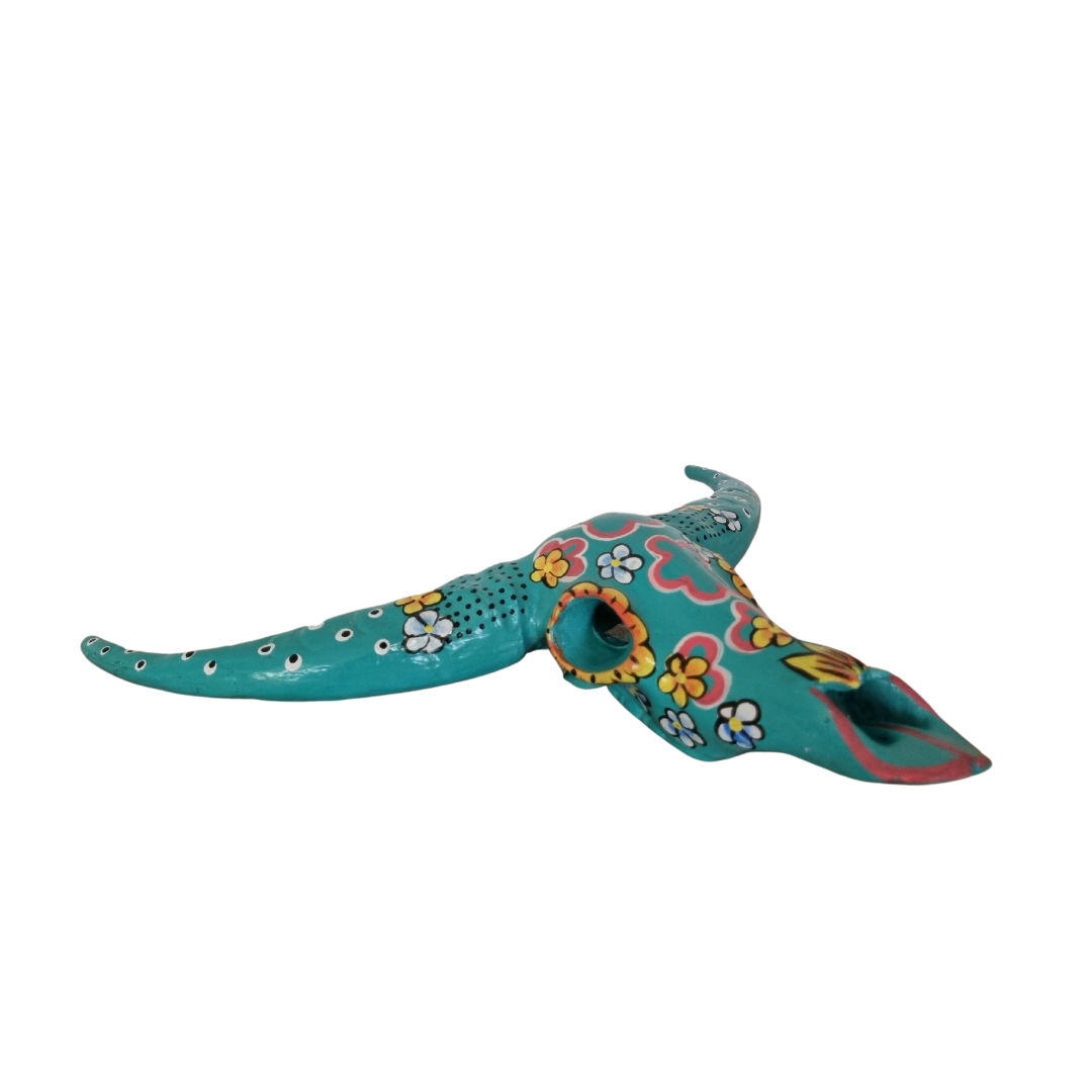 Handcrafted Floral Resin Bull Skull in Turquoise photographed from a low angle, showcasing the full horn span, sculptural form, and intricate pink, yellow and white floral detailing across the resin surface, 45cm x 25cm wall art by Azure Decor