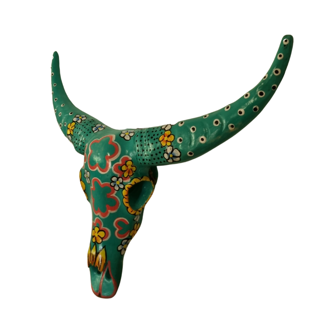 Handcrafted Floral Resin Bull Skull in Turquoise shown from a side angle, highlighting the intricate red, yellow and white floral patterns, dotted detailing, and sculptural depth of the resin craftsmanship, 45cm x 25cm wall art by Azure Decor