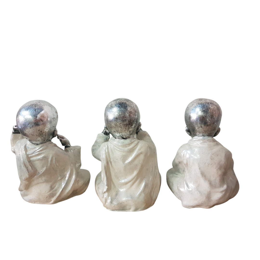 Three Wise Buddha Statues side view Back view