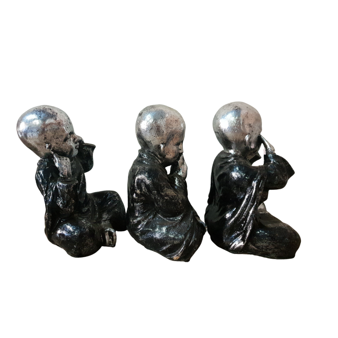 Three Wise Buddha Statues side view