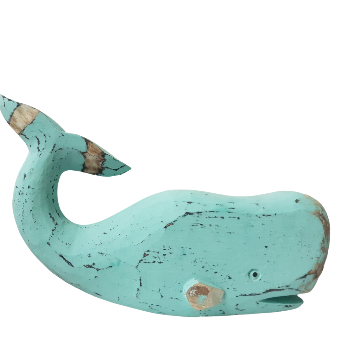 A wooden carved whale decoration in turquoise color with a rustic finish.