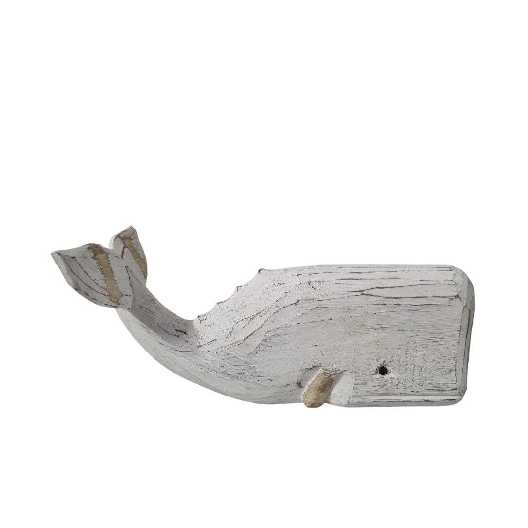 A wooden carved whale decoration in white smaller style with a rustic finish.