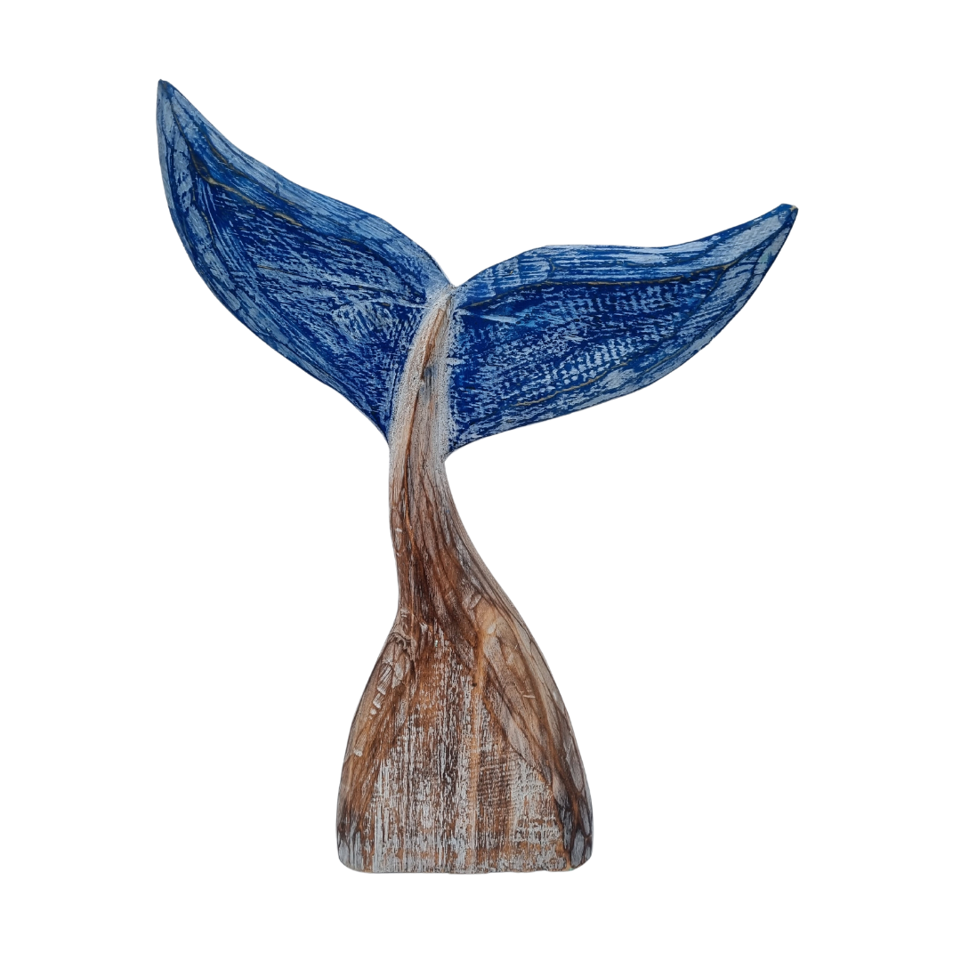 A handcrafted wooden carving of a whale tail with natural wood color and subtle blue hints.